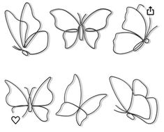 four butterflies cut out from paper with the words love on them and one has a heart