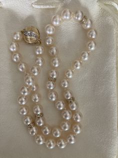 Gorgeous vintage Akoya pearl necklace, 17.5" with diamond spacers, 13 mm diamond clasp all in 14k. The pearls are 8-8.5 mm and display high luster and lovely ivory pink coloring. Well matched with smooth skins. Diamonds on both sides of round clasp. Beautiful vintage pearl diamond necklace. Comes in lovely cream suede drawstring pouch. Vintage Akoya Pearl Drop Necklace, Vintage Akoya Pearl Necklace For Formal Occasions, Formal Vintage Akoya Pearl Necklace, Classic Pearl Necklace With Diamond Accents For Anniversary, Classic Diamond Pearl Bracelet For Formal Occasions, Formal Akoya Pearl Necklace With High Luster, Formal Pearl Bracelet With Round Beads And Pendant, Formal Pearl Necklace With Round Beads, Diamond Pearl Necklace For Wedding