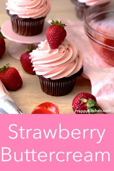 strawberry buttercream cupcakes with fresh strawberries on top