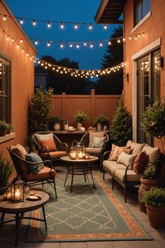 an outdoor patio with lights strung over it and furniture on the ground, surrounded by potted plants