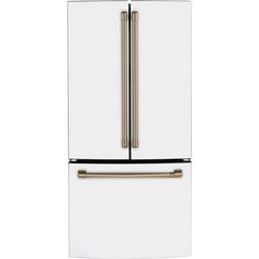 a white refrigerator freezer sitting next to a metal handle on an oven door drawer