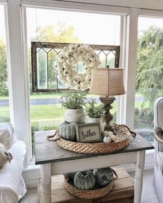 a living room with a couch, table and window