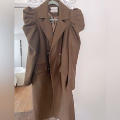 Puff Shoulder Brown Trench Coat. Never Worn. Amazing Find ! I Just Didnt End Up Wearing It Chic Winter Outerwear With Puff Sleeves, Chic Puff Sleeve Winter Outerwear, Chic Puff Sleeve Outerwear For Winter, Trendy Puff Sleeve Fall Outerwear, Trendy Puff Sleeve Outerwear For Fall, Fall Workwear Outerwear With Puff Sleeves, Fall Workwear Puff Sleeve Outerwear, Winter Workwear Outerwear With Padded Shoulders, Chic Puff Sleeve Workwear Outerwear