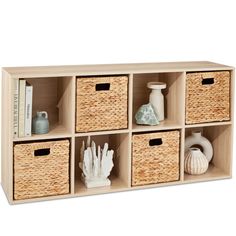 a shelf with baskets and books on it