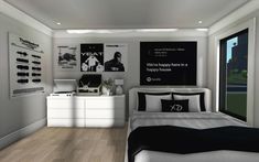 a bedroom with white walls and wood flooring is decorated in black and white colors