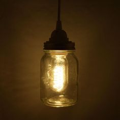 a mason jar with a light bulb hanging from it