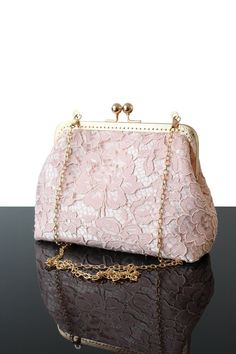 The evening bag is an essential from the Olga's Luxury Creation to make your gala evenings a success. They allow you to combine elegance and style to stay chic in all circumstances. Our unique evening bags are made with satin, French and high fashion lace as well as velvet and silk. The unique know-how is implemented in every creations to give you the best bags. Discover our large collection of Rose gold wedding clutch and evening bags to succeed at best your different evenings. Designer Rose go Wedding Clutch Bag, Rose Purse, Lace Bag, Silk Purse, Bridesmaid Gift Bags, Clutch Bag Wedding, Pink Shoulder Bag, French Silk, Wedding Clutch