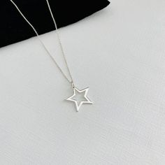 Gorgeous shiny sterling silver open star necklace. This lovely simple star charm is available on a choice of sterling silver chains.A stylish necklace perfect for everyday styling, to compliment your look. Select a length to suit your style, and wear solo or layer with other necklaces.Lovely necklace you'll love to wear or love to give.DETAILS:+ Quality chain and charm in sterling silver+ Spring clasp fastening+ Star approximately 20mm+ Gift-ready in our stylish white KookyTwo box+ Handmade by u Minimalist Star Necklace For Everyday, Everyday Star Charm Necklace, Everyday Sterling Silver Star Jewelry, Sterling Silver Star Jewelry For Everyday, Everyday Sterling Silver Star Charm Necklace, Sterling Silver Star Charm Necklace For Everyday, Minimalist Silver Star Necklaces, Silver Minimalist Star Necklace, Minimalist Silver Star Charm Necklace