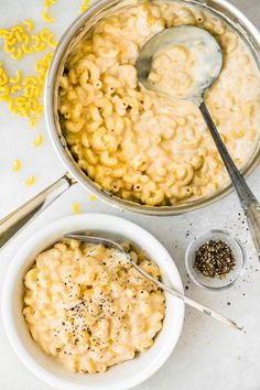 two bowls of macaroni and cheese with a spoon