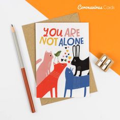 a card that says you are not alone with two cats and a bird on it