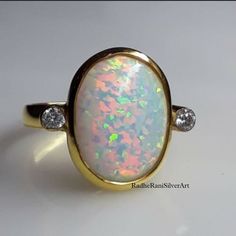 Natural Oval Fire Opal Gemstone 925 Sterling Silver 14k Gold Plated Handmade Boho Style Art Dainty Ring For Women's By Radhe Rani Silver Art Gemstone - Opal  Stone Shape - Oval  Jewelry Type - Ring Stone Colour - Colorful  By Radhe Rani Silver Art Hallmarked Opal Anniversary Ring, Yellow Gold Oval Opal Ring In Sterling Silver, Hallmarked Open Opal Ring For Anniversary, Polished Opal Ring For Anniversary, Fine Jewelry Opal Promise Ring With Polished Finish, Opal Open Ring With Polished Finish For Anniversary, Anniversary Opal Open Ring With Polished Finish, Opal Rings With Polished Finish For Anniversary, Polished Finish Opal Ring For Anniversary