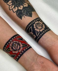 two people with matching tattoos on their arms