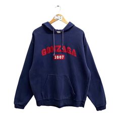 Code : p/630 Vintage 00s Gonzaga University Navy Hoodie Large Gonzaga Bulldogs Sweatshirt Gonzaga Sweater Pullover Spell Out Patches Logo Gonzaga Jumper Size on Tag : L Details Measurement  Arm Pit to Arm Pit : 25"inches Back Collar to Hem : 28"inches Condition :  Great Vintage Condition(used clothing.No Holes And No Stain.Please refer pictures detail.‼️ Cotton College Top With Kangaroo Pocket, Winter College Sweatshirt With Kangaroo Pocket, Vintage Sweatshirt With Kangaroo Pocket For Streetwear, Crew Neck Top With Kangaroo Pocket For College, Vintage Winter Tops With Drawstring Hood, Vintage College Hoodie Tops, Vintage Sweatshirt With Kangaroo Pocket For Fall, Vintage Fall Sweatshirt With Kangaroo Pocket, 90s Hoodie Tops For Winter