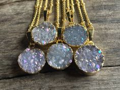 "These adorable angel aura crystal druzy necklaces have a truly spectacular sparkle! Each real druzy charm pendant is dipped in your choice of gold or silver plating and hung from your choice of length: 18\" for a standard length, or 20\" for extra length (Model is wearing 18\"). You may choose your chain in gold plated, real 14K Gold filled, silver plated, or real .925 Sterling silver. You may also choose your chain style: bead, link, or cable. I highly recommend the real 14K Gold filled and St Sparkling Gold Crystal Necklace Gift, Sparkling Gold Crystal Necklace As Gift, Sparkling Gold Crystal Necklace For Gift, Gold Sparkling Crystal Necklace As Gift, Angel Aura Quartz Necklaces, Raw Stone Necklace, Druzy Jewelry, Raw Crystal Necklace, Aura Crystals