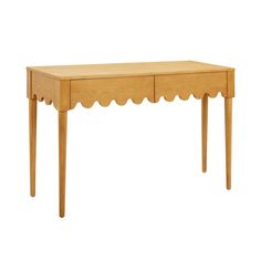 a wooden table with scalloped legs and a drawer on one side, against a white background