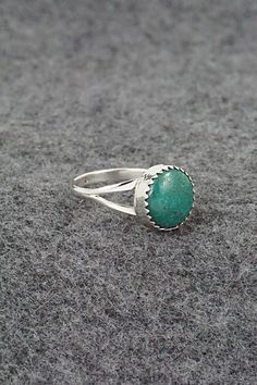 This turquoise and sterling silver ring was made by Navajo silversmith Robert Martinez. The inside of the band is stamped sterling.Size: 5.75Length: 3/8"Width: 3/8"Free shipping on all orders! We ship with USPS and always include tracking. All orders ship within a day of payment.Returns are accepted up to 30 days after you receive your order. Just send us a message. Our shop offers cash back or store credit. The item must be returned in new condition. Untreated Silver Turquoise Ring, Southwestern Sterling Silver Turquoise Ring, Untreated Turquoise Sterling Silver Ring, Southwestern Style Stamped 925 Turquoise Ring, Southwestern Style Turquoise Ring Stamped 925, Turquoise Emerald Ring Sterling Silver 925, Robert Martinez, Bear Carving, Pearl Chain