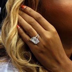 a close up of a person wearing a ring