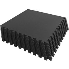 black foam tiles are stacked together on top of each other