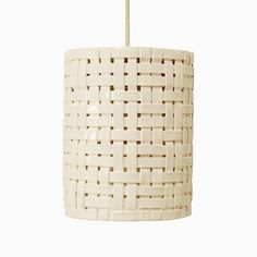 a white light hanging from a ceiling fixture with woven fabric on the top and bottom