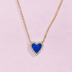 This small gemstone heart necklace with pave outline makes for the perfect gift. We love how it looks worn alone or layered with other chains! Fine Jewelry Blue Heart Necklace, Blue Heart-shaped Fine Jewelry Necklace, Blue 14k Gold Heart Pendant Jewelry, Blue Heart Pendant Necklace With Diamond Accents, Blue 14k Gold Jewelry With Heart Cut, Blue 14k Gold Heart Cut Jewelry, Blue Diamond Heart Necklace, Heart Gemstone, Blue Lapis