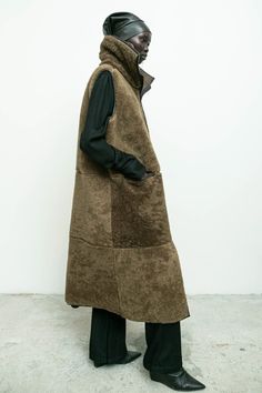 100% shearling sheep fur with 100% vegetable dyed leather/ long vest/ zipper closure/ front pockets/ high collar Amam is 5'9" size 2 wearing size S Fall Sheepskin Sleeveless Vest, Sleeveless Sheepskin Vest For Fall, Vest Zipper, Long Vest, Accessories Bags Shoes, Knit Bottom, Long Vests, Outerwear Sweater, High Collar