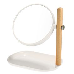 a magnifying glass with a wooden stick sticking out of it's side