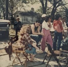 a group of people sitting around each other