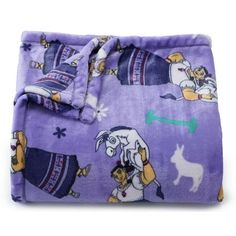 a purple blanket with cartoon characters on it