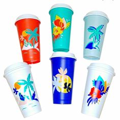 six different colored cups with palm trees on the sides and one is red, white, blue