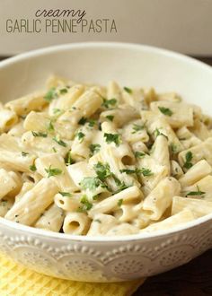 a white bowl filled with macaroni and cheese