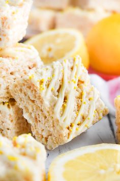 lemon scones with white frosting and yellow sprinkles are stacked on top of each other