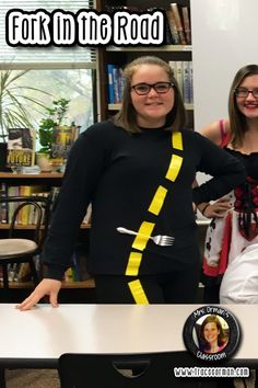 two women standing in front of a table with forks and spoons on it that says fort in the road