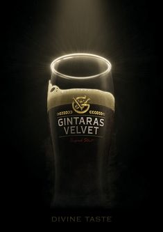 a lit up beer glass sitting on top of a table