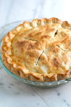 a pie sitting on top of a glass plate