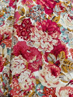 the fabric is very colorful and has many flowers on it