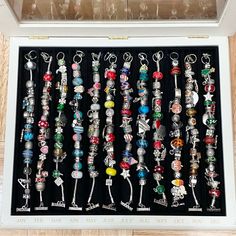 a display case filled with lots of charms