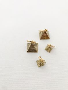 Beautiful 3D brass pyramids on gold-filled hoops. •Small Pyramid 0.55”•Large Pyramid 0.90” *Lightweight & perfect for daily wear, brass symbols will require occasional polishing. Packaged for gift giving. *Sold individually. Adjustable Geometric Gold Jewelry, Geometric Gold Nickel-free Jewelry, Nickel-free Geometric Gold Jewelry, Gold Geometric Nickel-free Jewelry, Gold Geometric Metal Jewelry, Gold Geometric Brass Jewelry, Geometric Gold Hoop Earrings For Everyday, Gold Geometric Hoop Earrings For Everyday, Everyday Geometric Gold Hoop Earrings