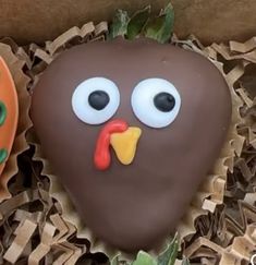 there are two decorated cookies in the shape of turkeys