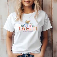 The Tahiti Floral Paradise Tee...Elevate your style with one of our favorite tees. This graphic t-shirt is perfect for your summer on the go to anywhere. T-shirt, Leisure wear, Quality shirt, Party t-shirt, Trendy t-shirt, Beach wear, Fashion t-shirt, T-shirt design, Latest t-shirt, Couple t-shirt, Birthday t-shirt, Season wear, Evening wears, Valentines t-shirt, Vintage t-shirt, AOP t-shirt, Classic t-shirt, T-shirt outfit, Street wear, Tee, Season t-shirt is a must-have for any beach vibes enthusiast. With its stylish and relaxing floral design, this shirt will transport you to the beautiful island of Tahiti and immerse you in its tropical charm.  Highlights: - Unisex jersey short sleeve tee made with 100% Airlume combed and ring-spun cotton for ultimate comfort - Soft cotton and quality White Tropical T-shirt With Letter Print, White Hawaiian T-shirt With Sublimation Print, Beach Wear Fashion, Flower Power Shirt, Outfit Street, Valentine T Shirts, Latest T Shirt, Customise T Shirt, Couple T-shirt