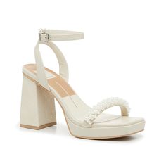 Dolce Vita-Alesia Sandal From bridal showers to brunch, the Alesia sandal adds a stylish touch to any look. This two-piece pair from Dolce Vita is complete with a subtle snake print heel, faux pearls along the strap, and a modern squared off toe detail. Complete with a delicate ankle strap to keep your steps secure. Unique Bride Shoes, Dolce Vita Pearl Heels, Wedding After Party Shoes, Chunky Bridal Heels, Short Wedding Heels Brides, Pearl Heels Brides, White Heels With Pearls, Outdoor Wedding Heels