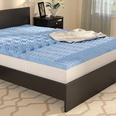 a bed that has been made out of legos and is in the middle of a room