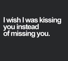 a black and white photo with the words i wish i was kissing you instead of missing you