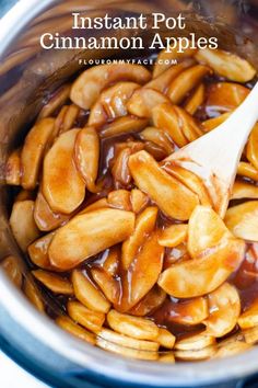 an instant pot cinnamon apples recipe in the crockpot with a wooden spoon and caramel sauce