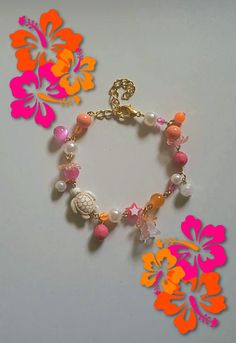 Gorgeous hibiscus bracelets, perfect for the summer! Cute Orange Bracelet, Pink And Orange Jewelry, White Flower Bracelets For Vacation, Adjustable Flower Beaded Bracelets For Beach, Pink Beach Bracelets For Beach Season, Pink Bracelets For Beach Season Vacation, Pink Bracelets For Beach Season, Pink Bracelets For Beach Vacation, Bohemian Flower Bracelets For Vacation