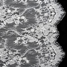 an image of white lace on black background