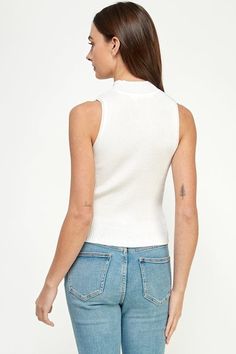 Elevate your style with the Ellison Rib Knit Mock Neck Sleeveless Top. This versatile tank top adds texture and flair to any outfit. The mock neck and sleeveless design give it a modern touch, while the semi-cropped hem adds a playful twist. A must-have staple in your wardrobe! Casual Sleeveless Mock Neck Top For Spring, Chic Ribbed Turtleneck Tank Top, Chic Sleeveless Mock Neck Top For Summer, Casual Sleeveless Mock Neck Top For Layering, White High Neck Tank Top For Spring, Chic Knit Turtleneck Tank Top, Chic Turtleneck Knit Tank Top, White Fitted Turtleneck Tank Top, Chic Turtleneck Sweater Vest For Spring