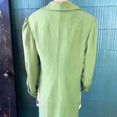 "Crazy unique vintage 60's/ 70's mod lime green/ chartreuse high low blazer jacket. Semi cropped in the front, duster length tail in back. Slightly puffed sleeve. Longer sleeve, looks great rolled once. 4 buttons in front with a secret black one being most important. Most likely polyester. Acetate feel lining. No tags! Definitely one of a kind. Will best fit women's medium. Good vintage condition, with signs of age and wear. Such a very rad piece. Im obsessed. Measurements laying flat: fabric do Retro Notch Lapel Blazer For Spring, Retro Fitted Long Coat, Fitted Retro Long Coat, Retro Green Outerwear For Spring, Green Fitted Long Coat, Tailored Green Outerwear For Spring, Retro Green Spring Outerwear, Fitted Green Outerwear For Spring, Vintage Tailored Green Blazer