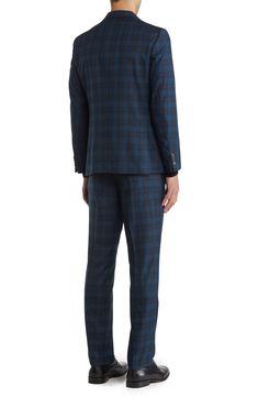 Whether it's an office occasion or a special event, this dapper suit with a classic plaid design can do it all. Jacket is lined; trousers are lined to the knee 81% polyester, 19% rayon Dry clean Imported Model stats: 6'1" height, 32" waist. Model is wearing size 40. Formal Plaid Suits With Notch Lapel, Plaid Notch Lapel Suit For Formal Occasions, Plaid Suit With Suit Collar For Work, Semi-formal Plaid Suit With Notch Lapel, Tailored Plaid Suit For Semi-formal Occasions, Plaid Suits For Semi-formal Occasions, Semi-formal Plaid Suit, Plaid Semi-formal Suit, Tailored Plaid Three-piece Suit For Formal Occasions