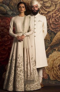 Ivory Color Wedding Gown – Panache Haute Couture Elegant Cream Anarkali Set With Zari Work, Traditional Cream Floor-length Gown, Elegant Off White Anarkali Set For Reception, Elegant Wedding Gown With Resham Embroidery, Elegant Off-white Anarkali Set For Reception, Luxury Beige Dress For Wedding, Elegant Traditional Drape Wedding Dress For Reception, Elegant Cream Lehenga With Intricate Embroidery, Elegant Off White Silk Anarkali Set