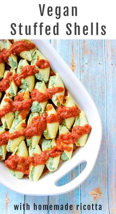 vegan stuffed shells with homemade ricotta sauce in a white casserole dish